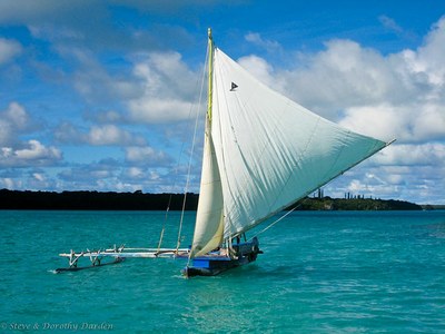 Traditional outrigger canoe under tail in the Ile des Pins